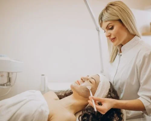 Woman visiting cosmetologist and making rejuvenation procedures